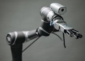 Close-up view of a robotic arm equipped with a video camera, showcasing modern technology.